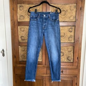 Levi’s High rise button fly jeans with frayed hem.